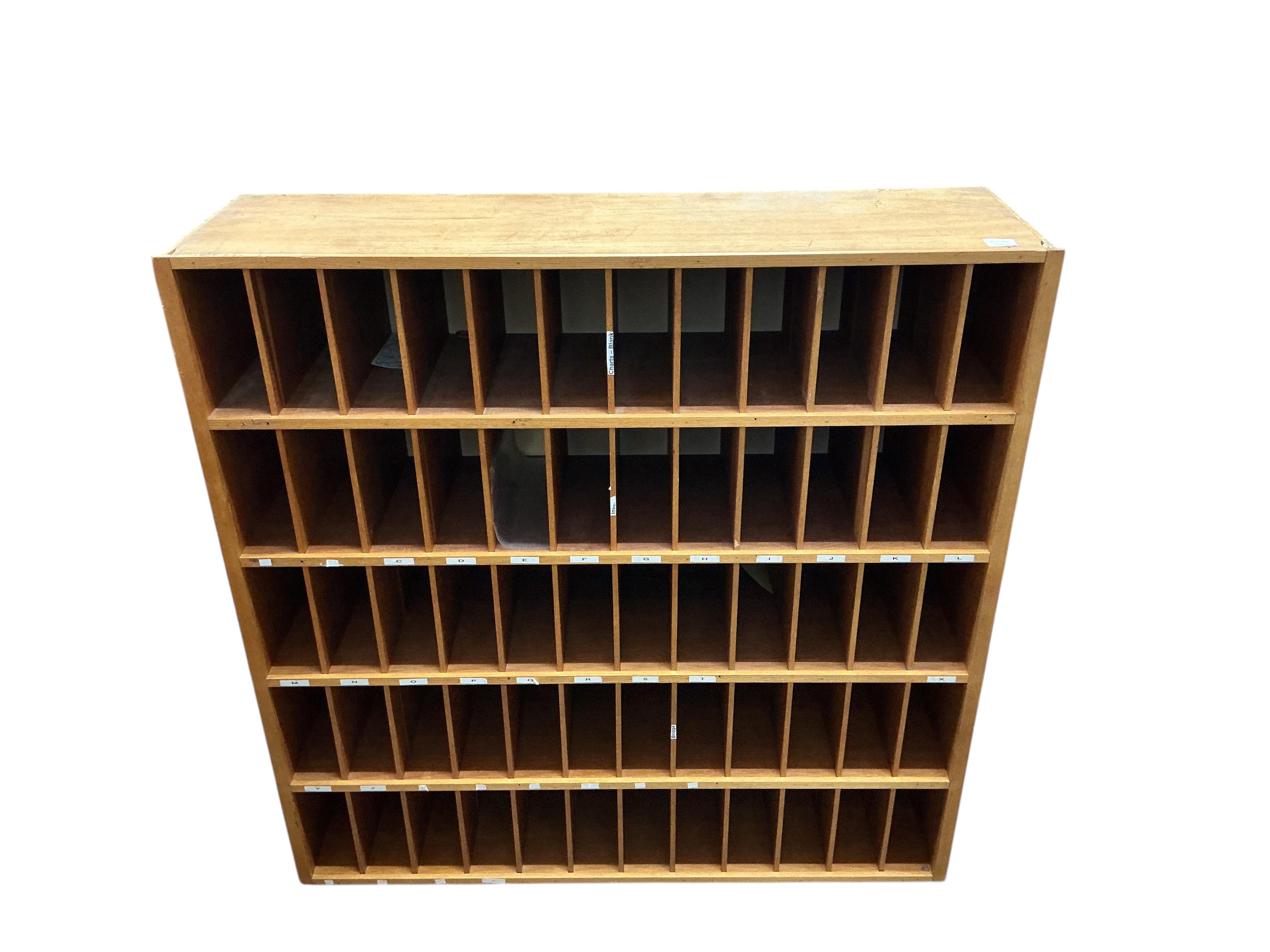 A mid century oak pigeonhole unit, width 122cm, depth 33cm, height 124cm